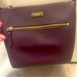 Kate Spade crossbody purse in a plum color